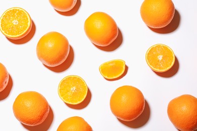 Photo of Fresh ripe oranges on white background, flat lay