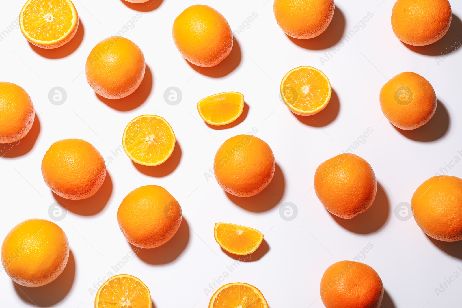 Fresh ripe oranges on white background, flat lay Photo of Fresh ripe oranges on white background, flat lay