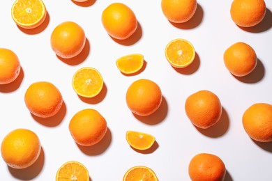 Photo of Fresh ripe oranges on white background, flat lay