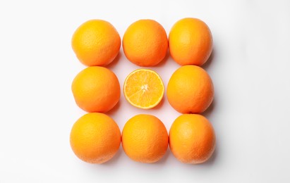 Photo of Fresh ripe oranges on white background, flat lay