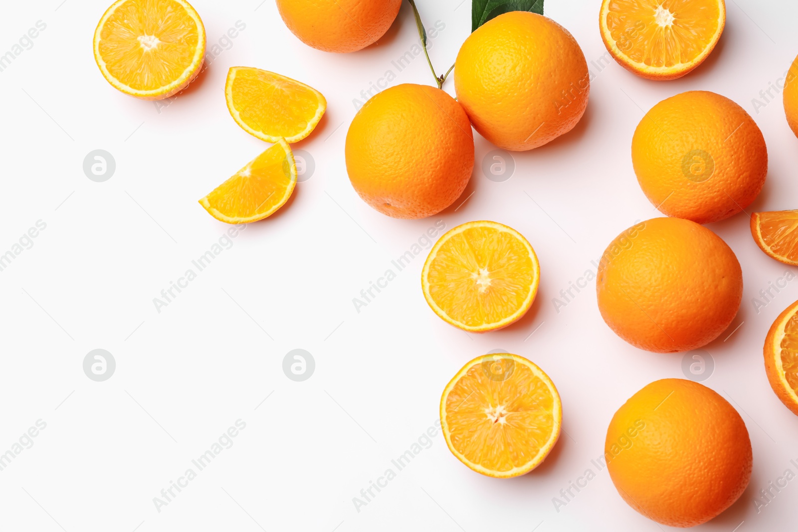 Fresh ripe oranges on white background, flat lay. Space for text Photo of Fresh ripe oranges on white background, flat lay. Space for text