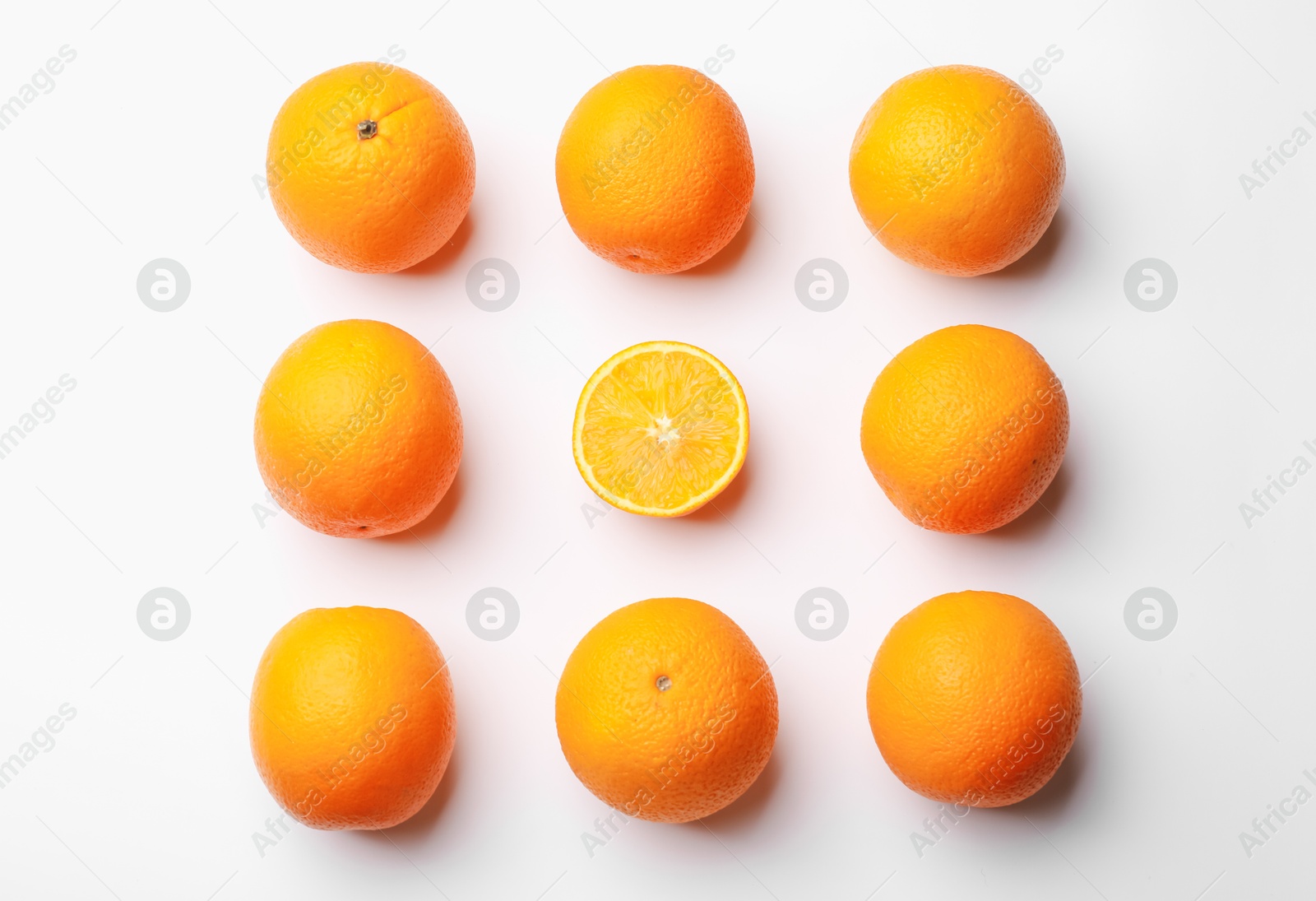 Fresh ripe oranges on white background, flat lay Photo of Fresh ripe oranges on white background, flat lay