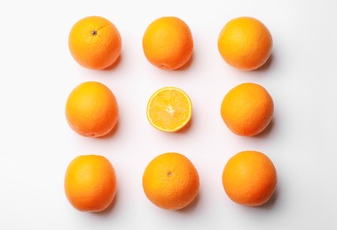 Photo of Fresh ripe oranges on white background, flat lay