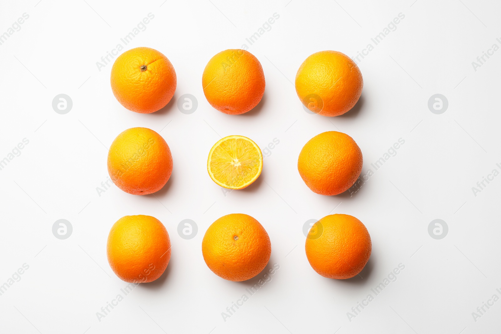 Fresh ripe oranges on white background, flat lay Photo of Fresh ripe oranges on white background, flat lay