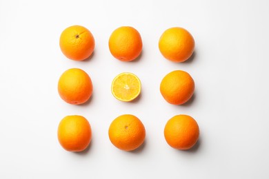 Photo of Fresh ripe oranges on white background, flat lay