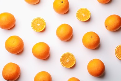 Photo of Fresh ripe oranges on white background, flat lay