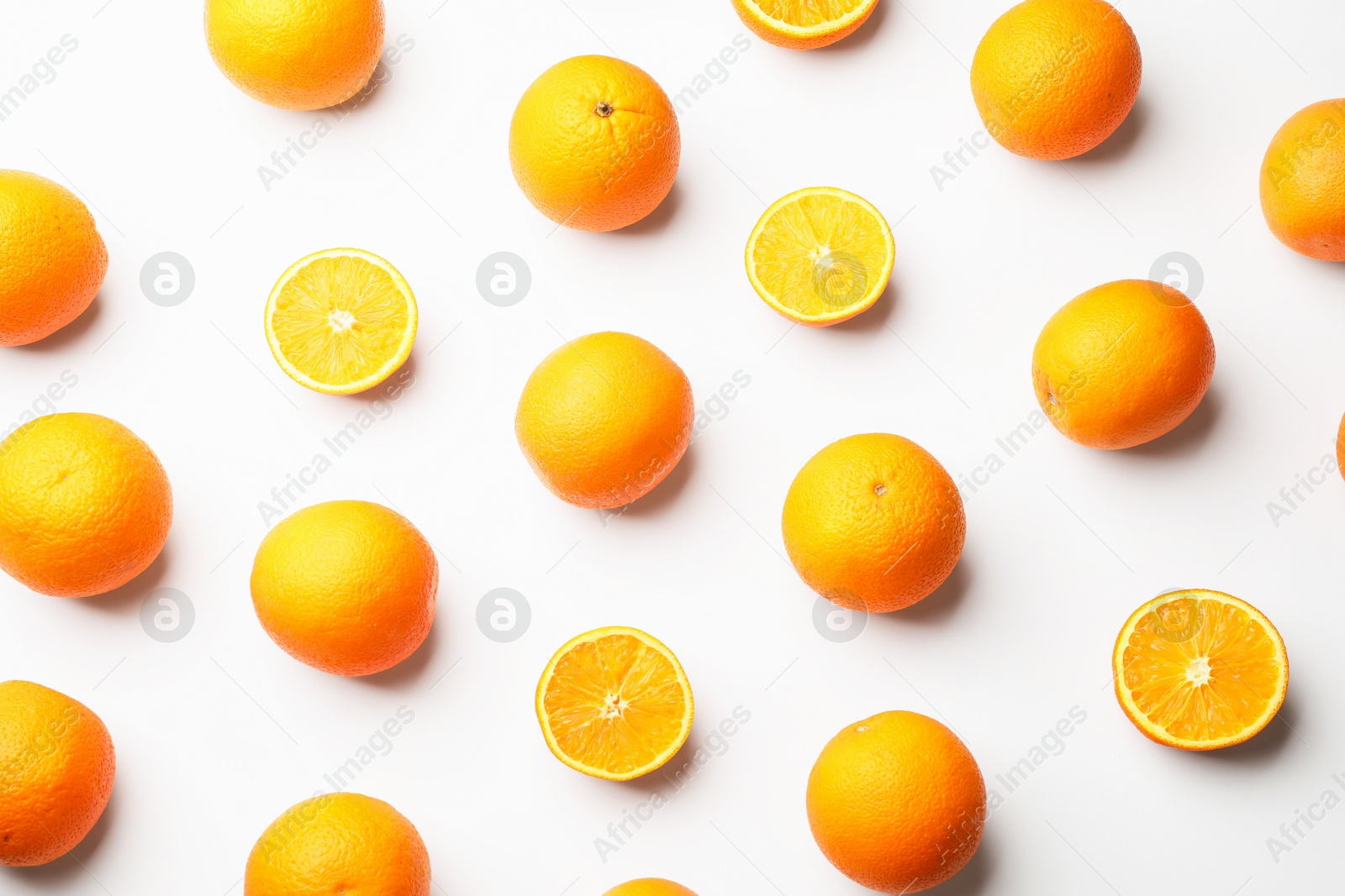 Fresh ripe oranges on white background, flat lay Photo of Fresh ripe oranges on white background, flat lay