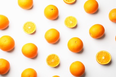 Photo of Fresh ripe oranges on white background, flat lay