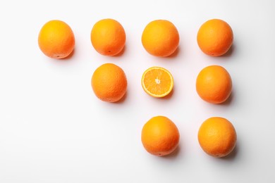 Photo of Fresh ripe oranges on white background, flat lay. Space for text