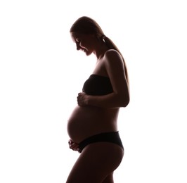 Photo of Silhouette of pregnant woman on white background