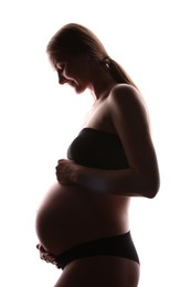 Photo of Silhouette of pregnant woman on white background