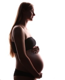 Photo of Silhouette of pregnant woman on white background