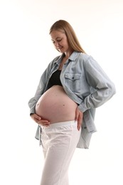 Photo of Portrait of beautiful pregnant woman on white background