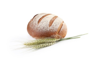 Photo of Fresh bread and green wheat spikes isolated on white