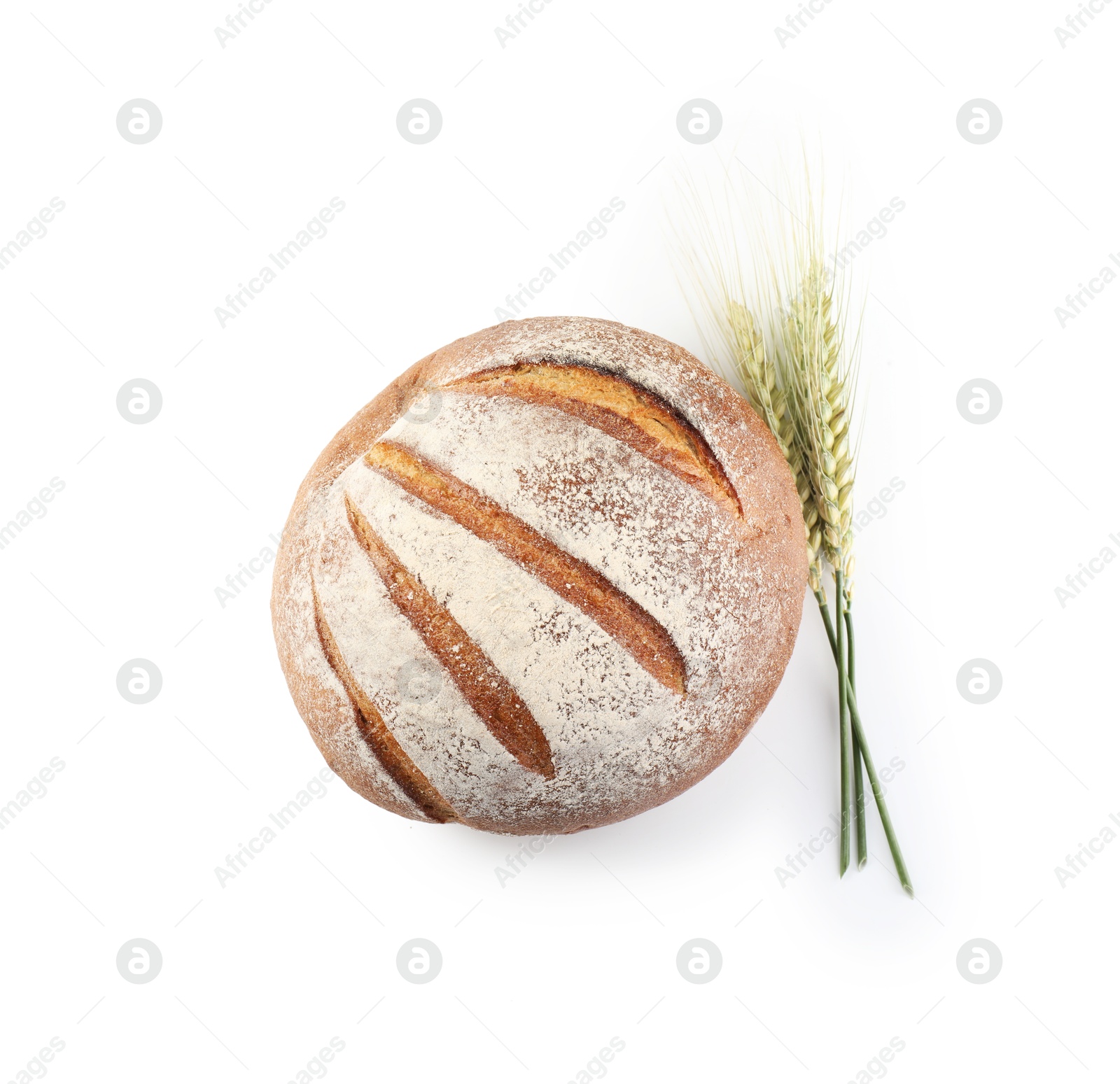 Photo of Fresh bread and green wheat spikes isolated on white, top view