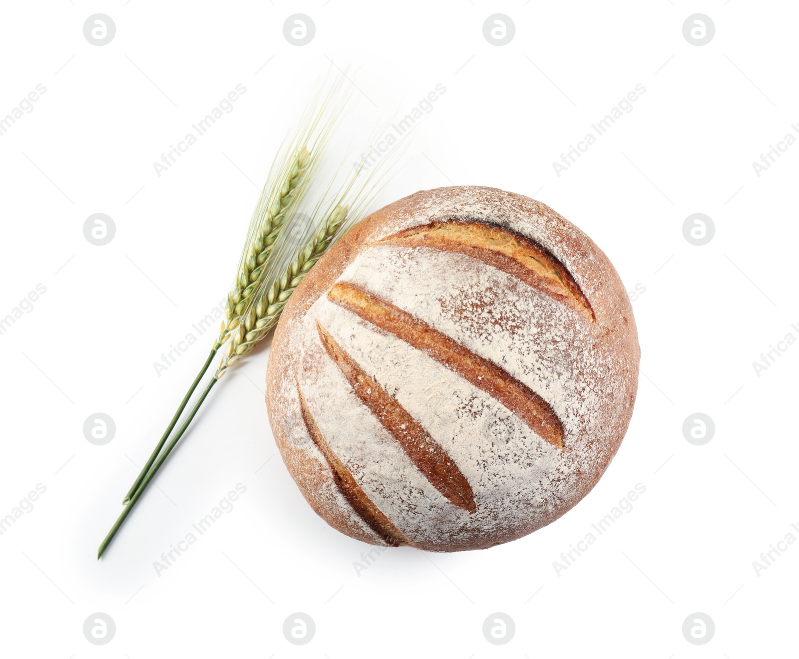 Photo of Fresh bread and green wheat spikes isolated on white, top view