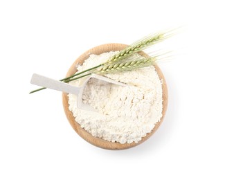 Photo of Flour in bowl and green wheat spikes isolated on white, top view
