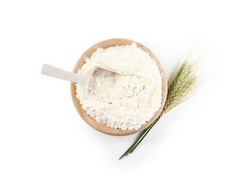 Photo of Flour in bowl and green wheat spikes isolated on white, top view
