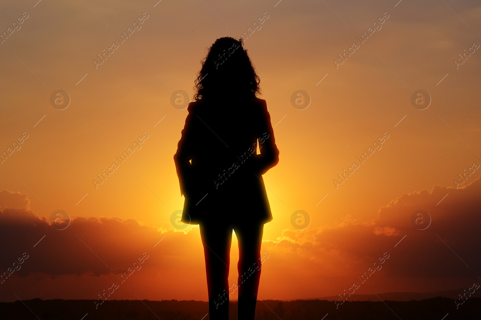 Image of Hope. Silhouette of woman under beautiful sky at sunset, double exposure