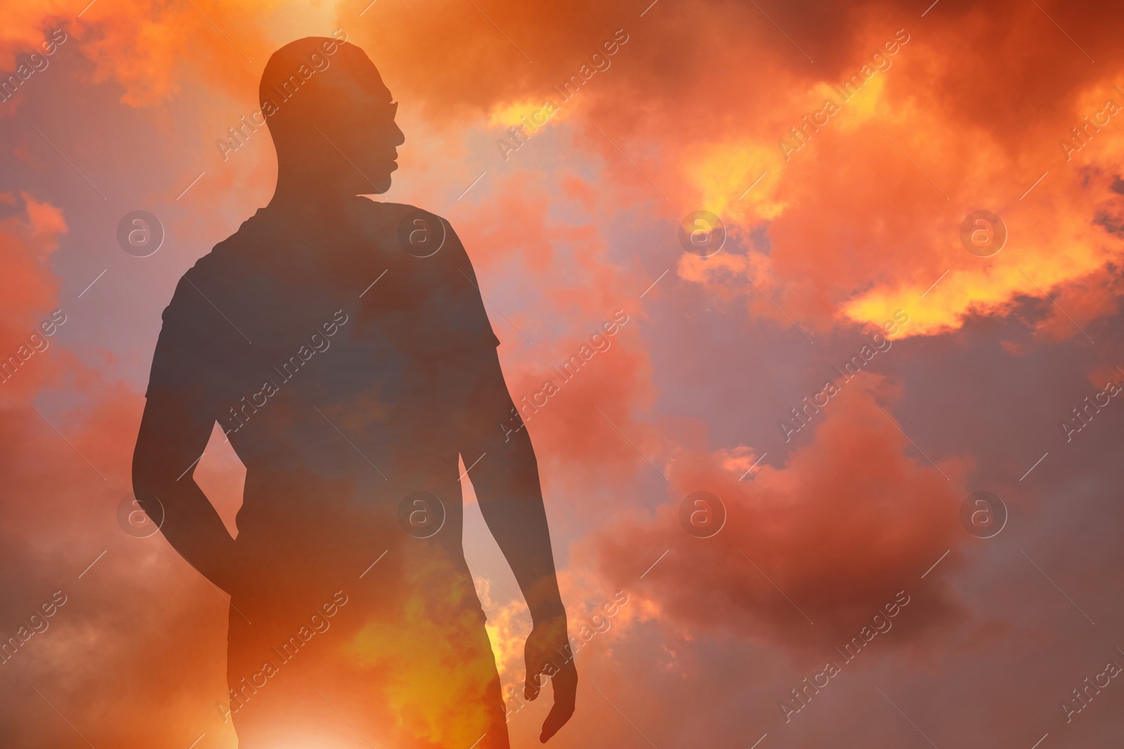 Hope. Silhouette of man under beautiful sky at sunset, double exposure Image of Hope. Silhouette of man under beautiful sky at sunset, double exposure