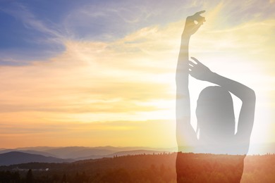 Image of Hope. Silhouette of woman in mountains under beautiful sky at sunrise, double exposure