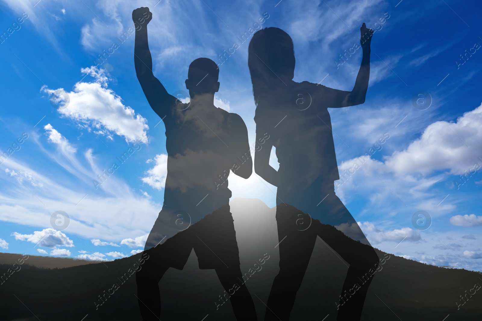 Hope. Silhouettes of man and woman on top of mountain, double exposure Image of Hope. Silhouettes of man and woman on top of mountain, double exposure