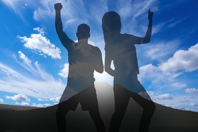 Image of Hope. Silhouettes of man and woman on top of mountain, double exposure