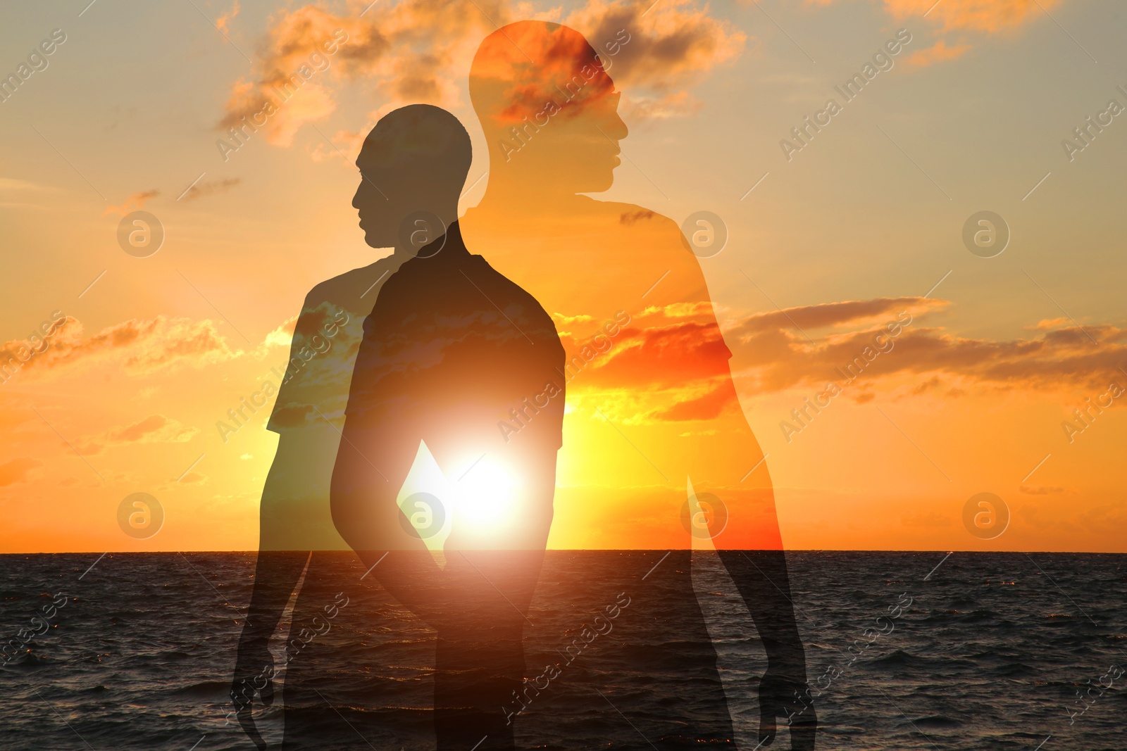 Hope. Silhouettes of man and seascape at sunrise, double exposure Image of Hope. Silhouettes of man and seascape at sunrise, double exposure