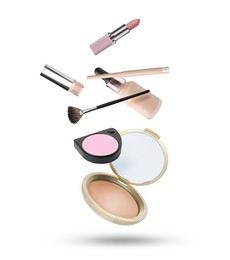 Image of Different makeup products in air against white background