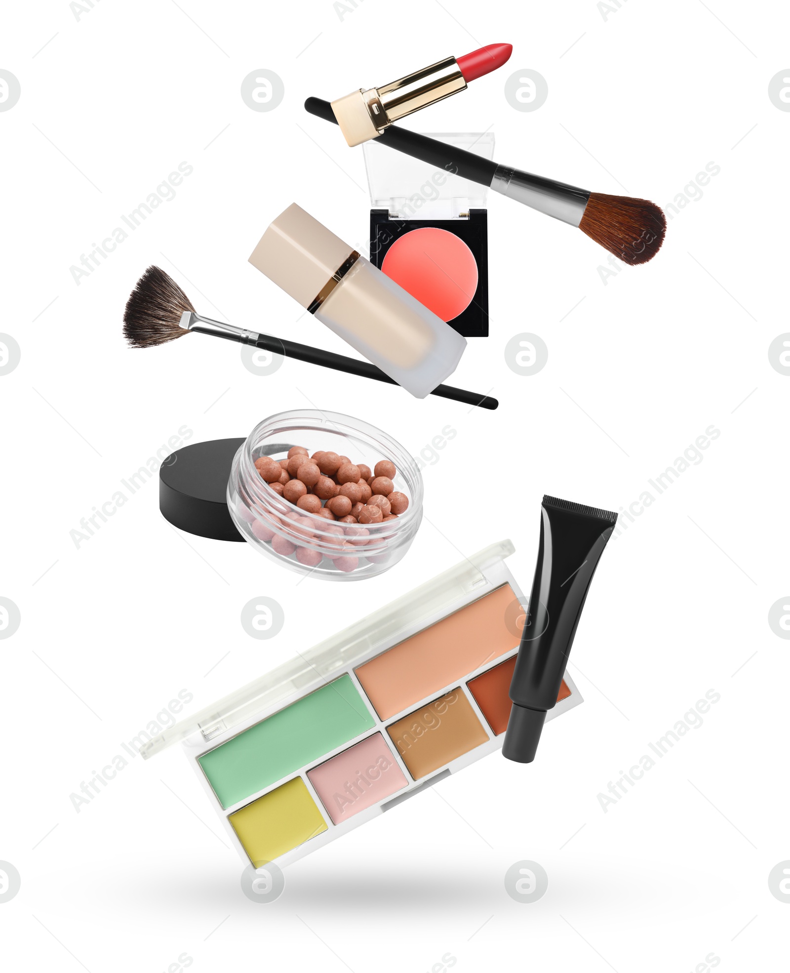 Image of Different makeup products in air against white background