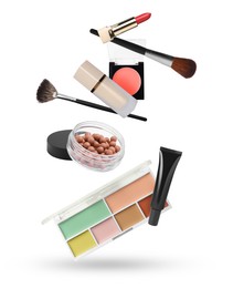 Image of Different makeup products in air against white background