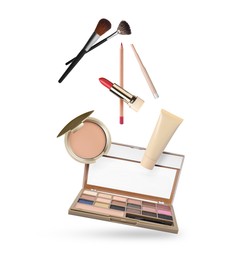 Image of Eyeshadow palette and other makeup products in air against white background