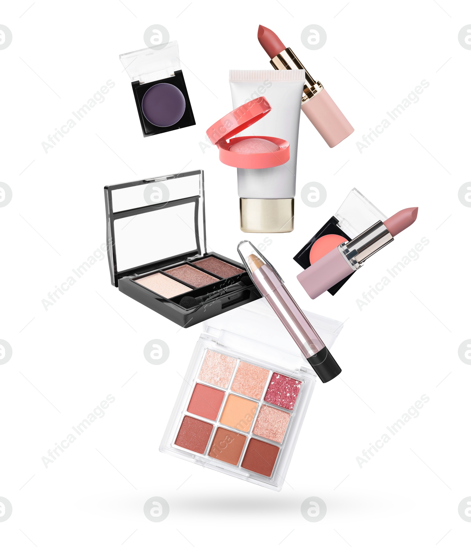 Image of Different makeup cosmetics in air against white background