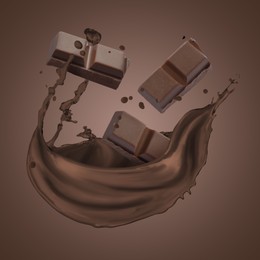 Image of Chocolate pieces and cacao drink splash on brown background