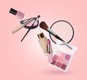 Image of Eyeshadow palette and other makeup products in air against pink background