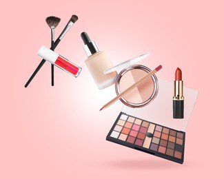 Image of Eyeshadow palette and other makeup products in air against pink background