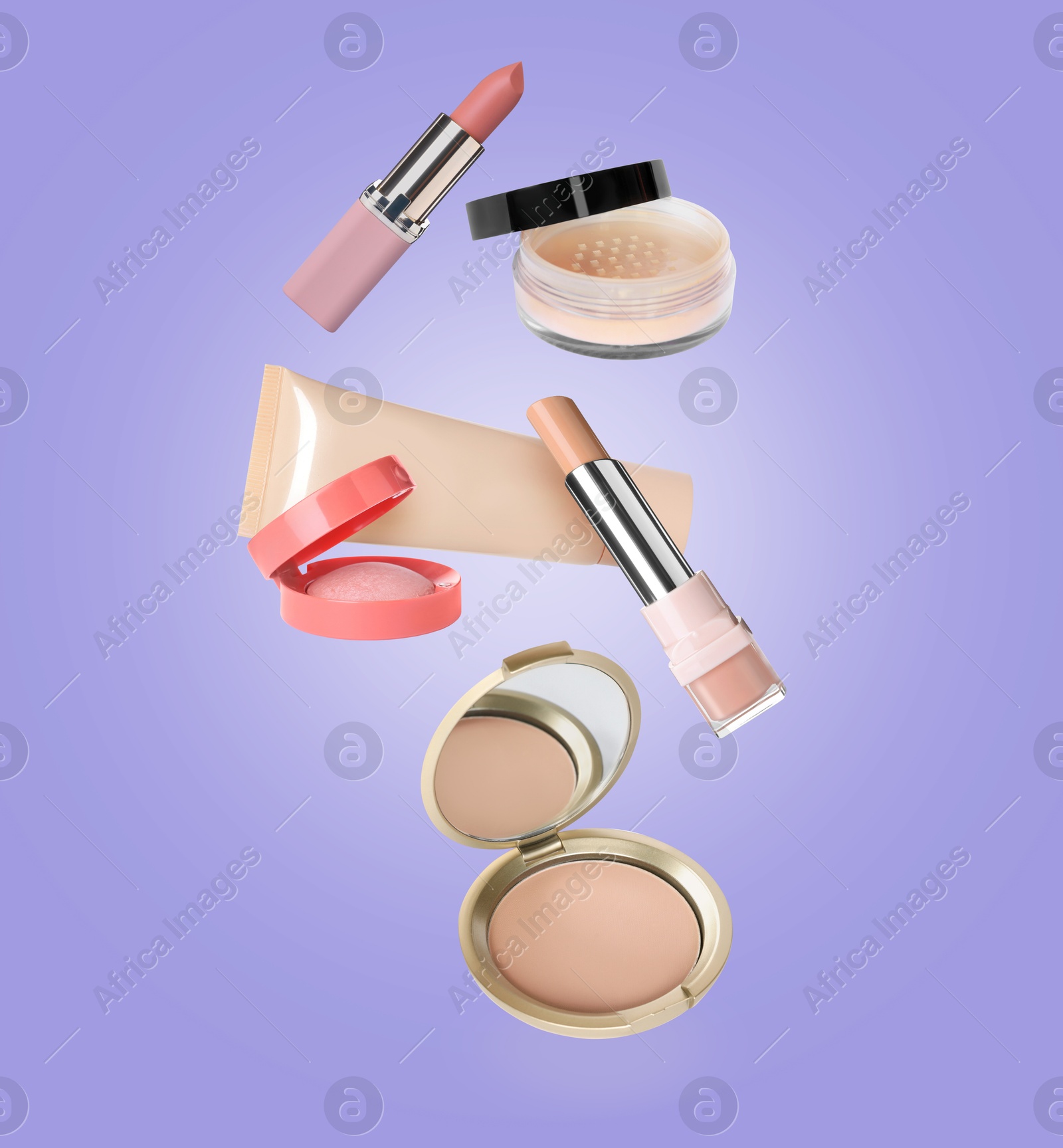 Image of Different makeup cosmetics in air against lilac color background