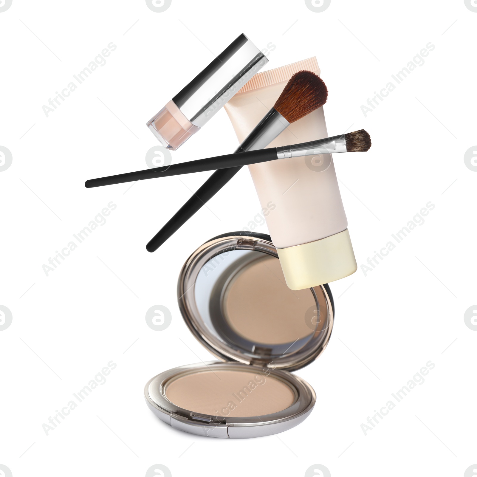 Image of Different makeup products in air against white background