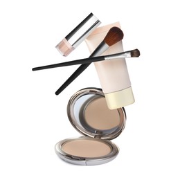 Image of Different makeup products in air against white background