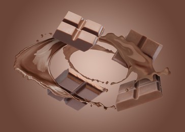 Image of Chocolate pieces and cacao drink splash on brown background