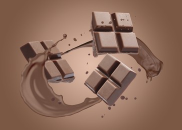 Image of Chocolate pieces and cacao drink splash on brown background