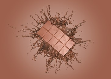 Image of Chocolate bar and cacao drink splash on brown background