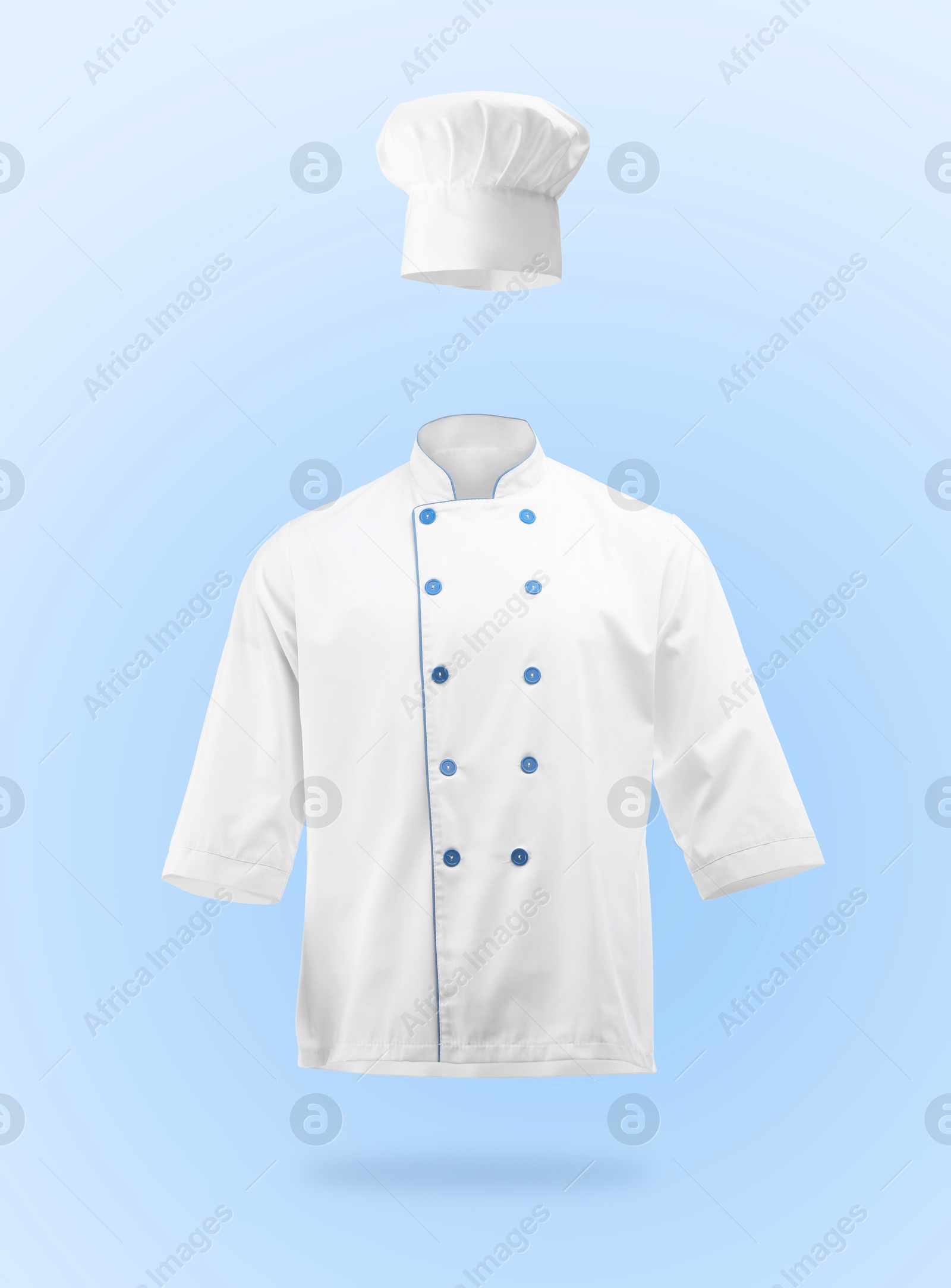 Chef's uniform in air against light blue background. Toque and jacket Image of Chef's uniform in air against light blue background. Toque and jacket