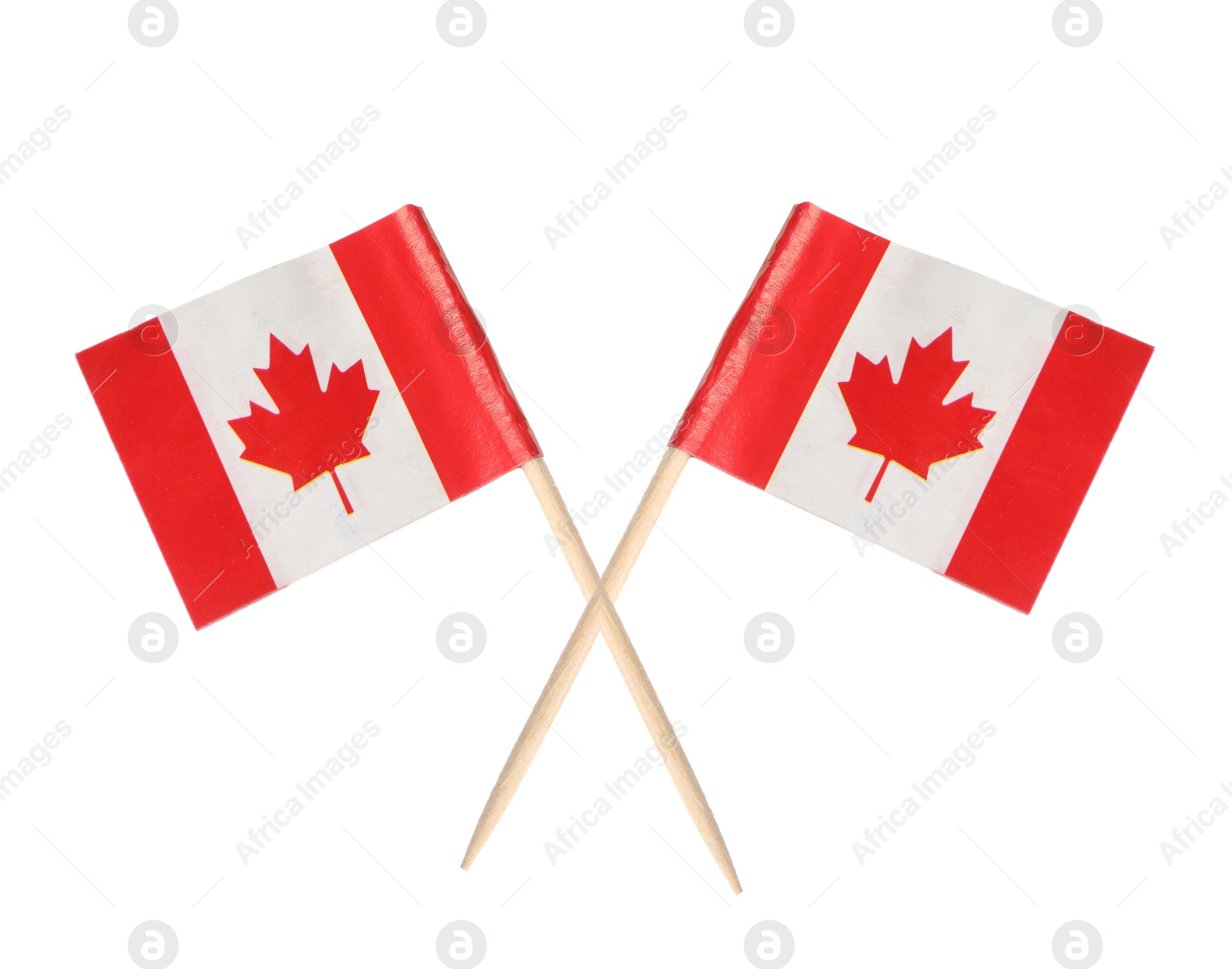 Small paper flags of Canada isolated on white Image of Small paper flags of Canada isolated on white