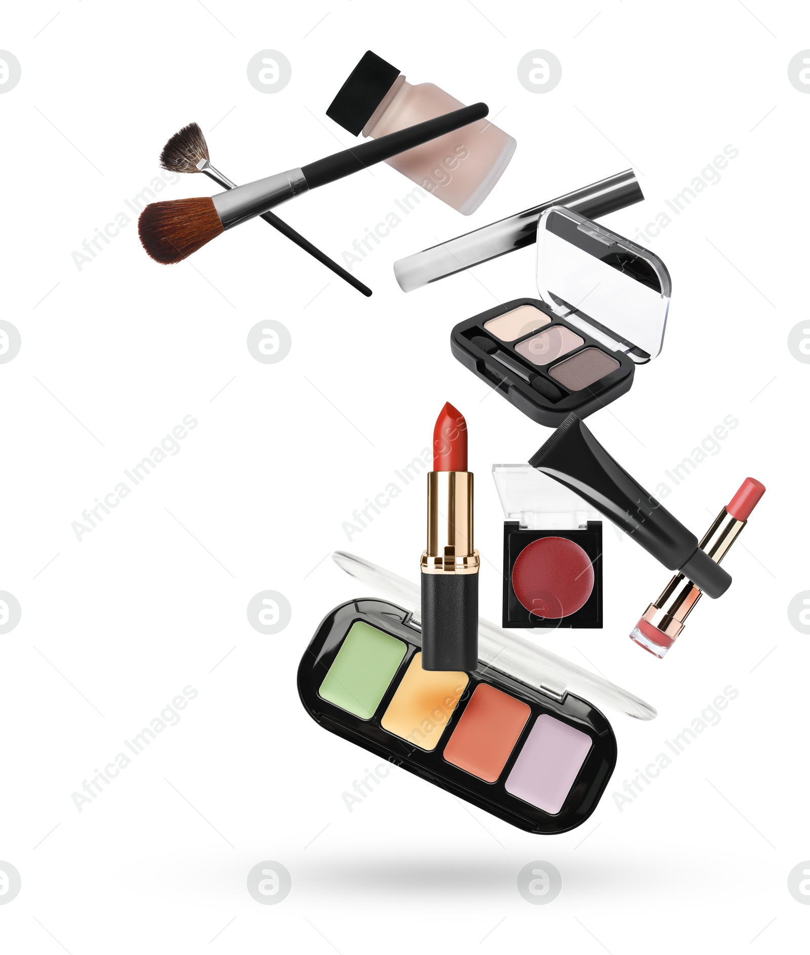 Different makeup products in air against white background Image of Different makeup products in air against white background