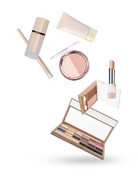Image of Different makeup cosmetics in air against white background
