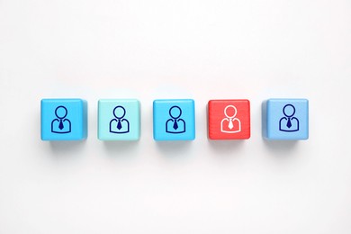Image of Dismissal. Red cube with red human icon among others on white background, top view