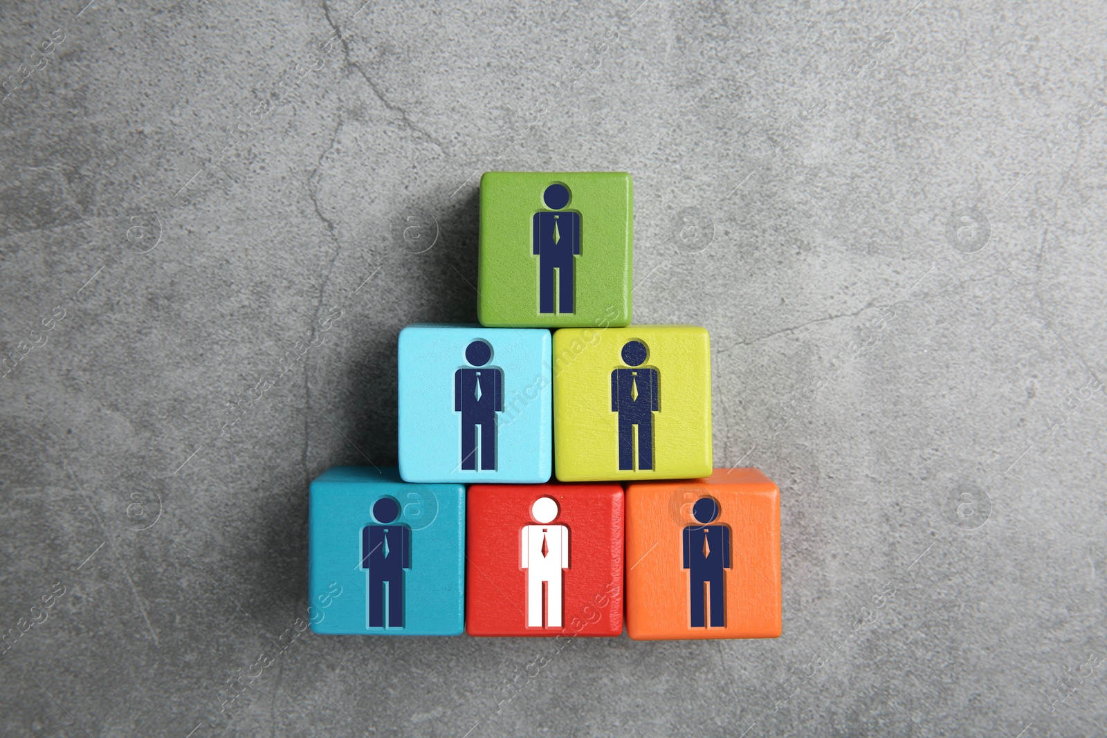 Dismissal. Red cube with white human icon among others with blue ones on grey background, top view Image of Dismissal. Red cube with white human icon among others with blue ones on grey background, top view