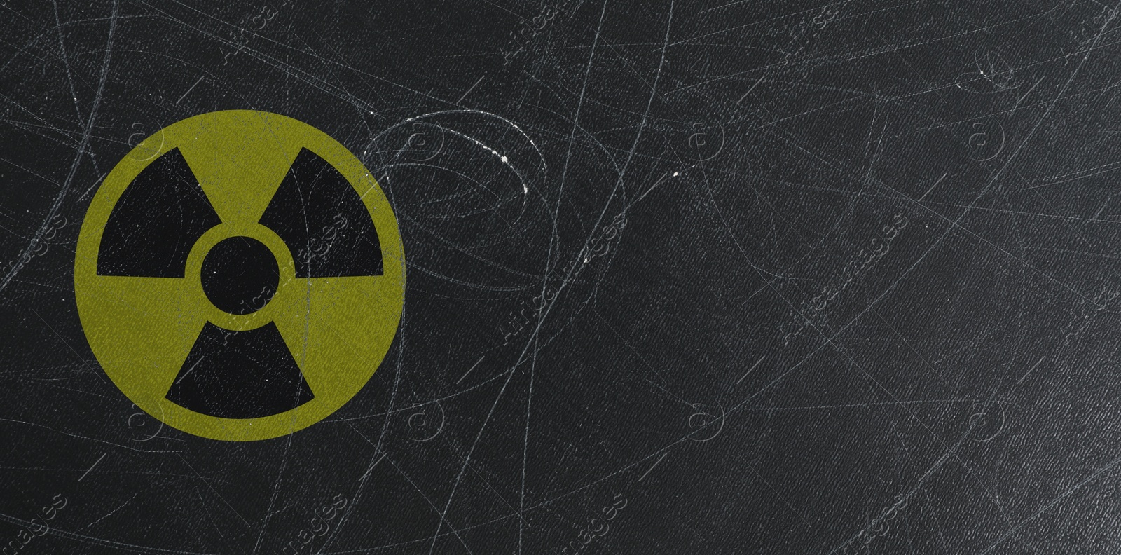 Image of Yellow radioactive sign on scratched black background, banner design. Radiological pollution