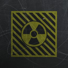 Image of Yellow radioactive sign on scratched black background. Radiological pollution
